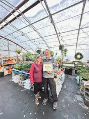 Callie Steinberg/Homer News
Wagon Wheel owners Steven and Stacey Veldstra pose with the Best of Business award for “Best Plant Shop” on Friday, Dec. 15.<ins>, 2023 in Homer, Alask</ins>