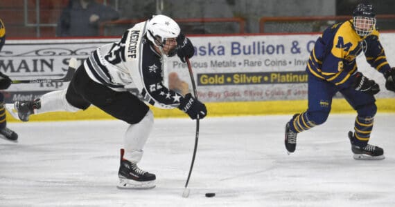 Soldotna’s Gehret Medcoff takes a shot in front of Homer’s Cody Thomas on Thursday, Jan. 18, 2024, at the Soldotna Regional Sports Complex in Soldotna, Alaska. (Photo by Jeff Helminiak/Peninsula Clarion)