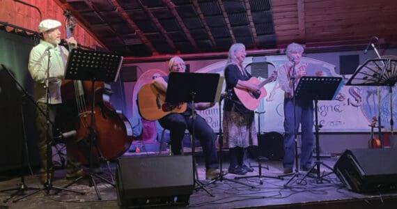 Photo by Emilie Springer/Homer News
“Banned” musicians Scott Bartlett, Martie Krohn, Cindy McKenna and Cathy Stingley provide music at the opening night for the Big Read at Alice’s Champagne Palace on Friday.