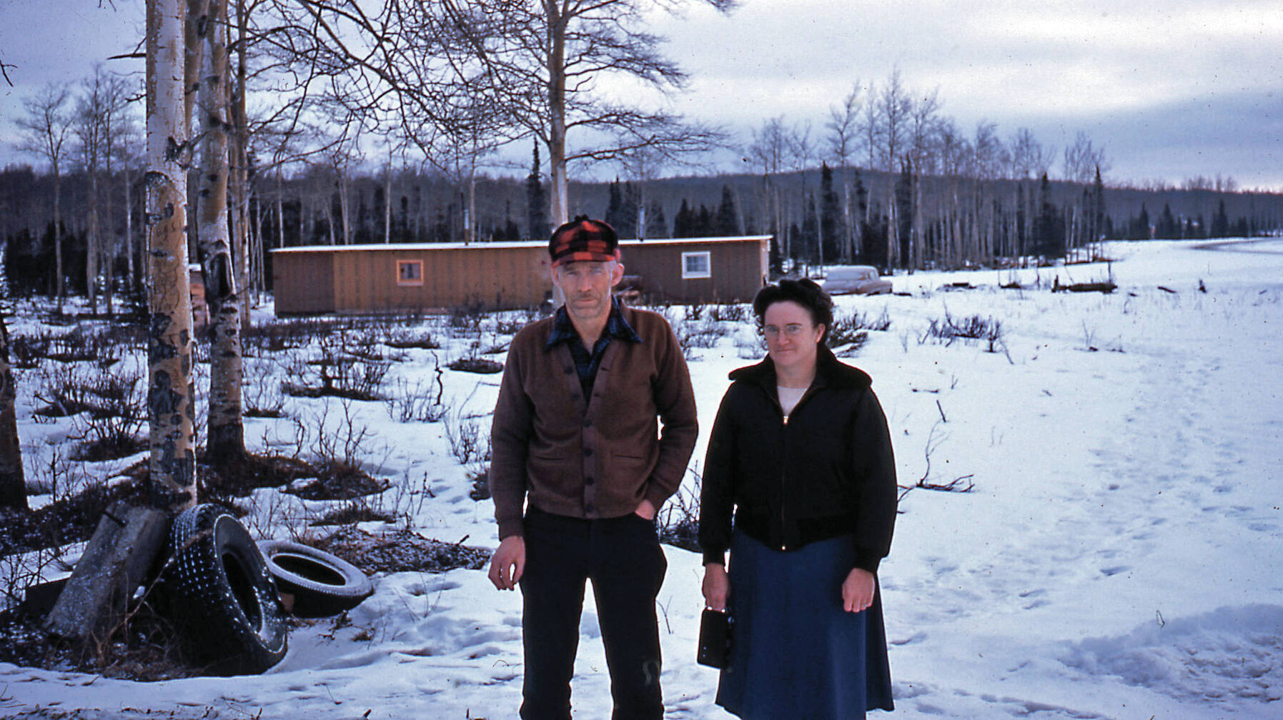 Ray Sandstrom photo courtesy of the KPC historical photo archive
Verona (Keeler) Wilson and her husband, Don Wilson, pose in 1953 near their grocery (in background), the first in Soldotna.