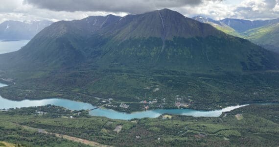 Areas cleared to make way for the Cooper Landing Bypass Project (bottom) can be seen above the Kenai River in Cooper Landing in this August 10, 2021, photo. (Jeff Helminiak/Peninsula Clarion file)