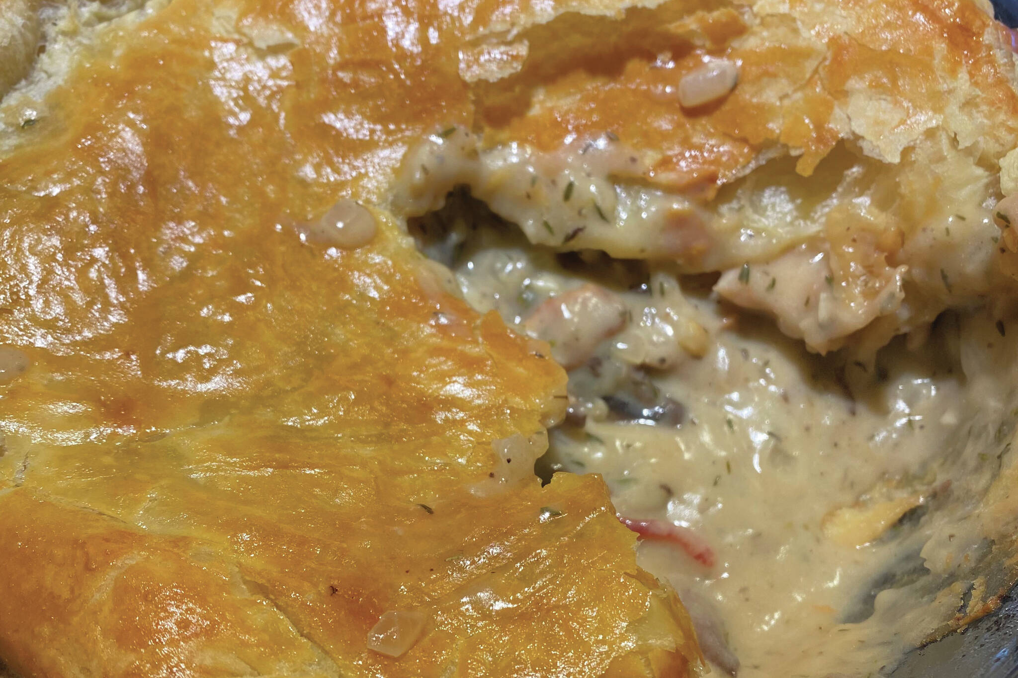 A creamy, rich and filling is ensconced a puff pastry crust in this French chicken and mushroom pie. (Photo by Tressa Dale/Peninsula Clarion)