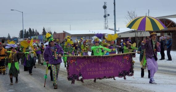 The Krewe of Gambrinus dances down Pioneer Avenue in the 69th Annual Winter Carnival Parade on Saturday, Feb. 11, 2023 in Homer, Alaska. Photo by Delcenia Cosman