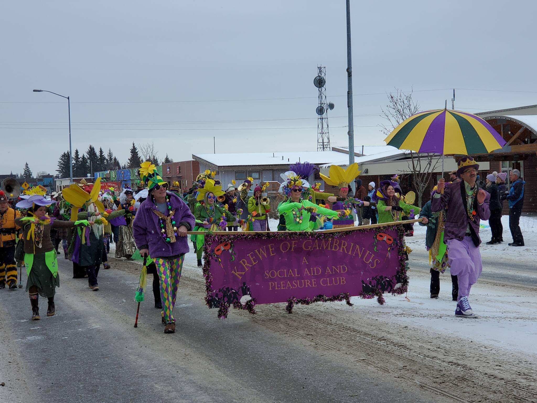The Krewe of Gambrinus dances down Pioneer Avenue in the 69th Annual Winter Carnival Parade on Saturday, Feb. 11, 2023 in Homer, Alaska. Photo by Delcenia Cosman