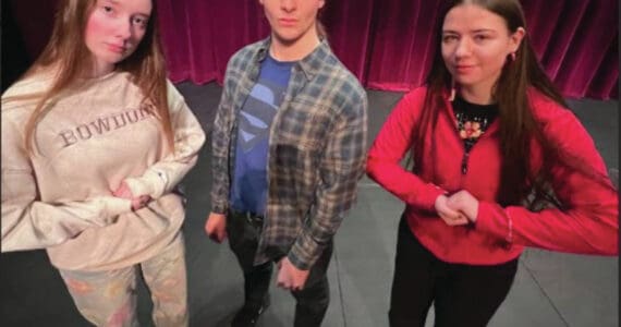 Photo provided by Homer High School Yearbook staff
Homer High School Poetry Out Loud competition winners Bea McDonough, Clark Milstead and Bryce Glidden on the Mariner High School Stage on Jan. 24.