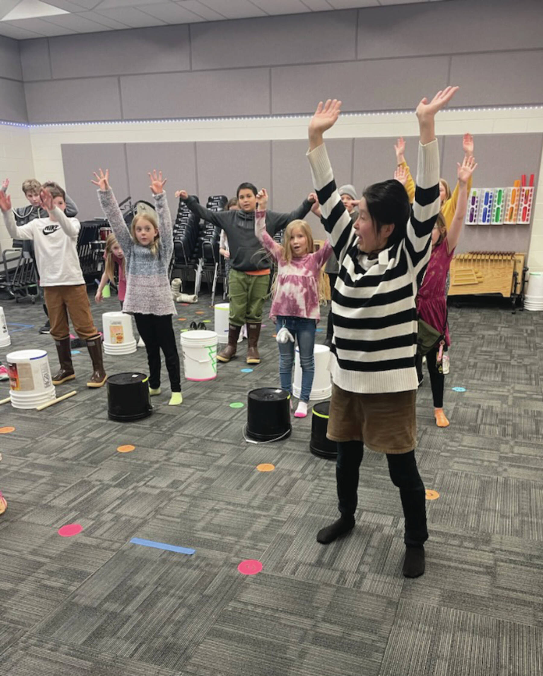 Megumi Beams with members of the West Homer Japanese Club practicing their routine for the Homer Winter Carnival Parade in the West Homer music room on Feb. 2.  Emilie Springer