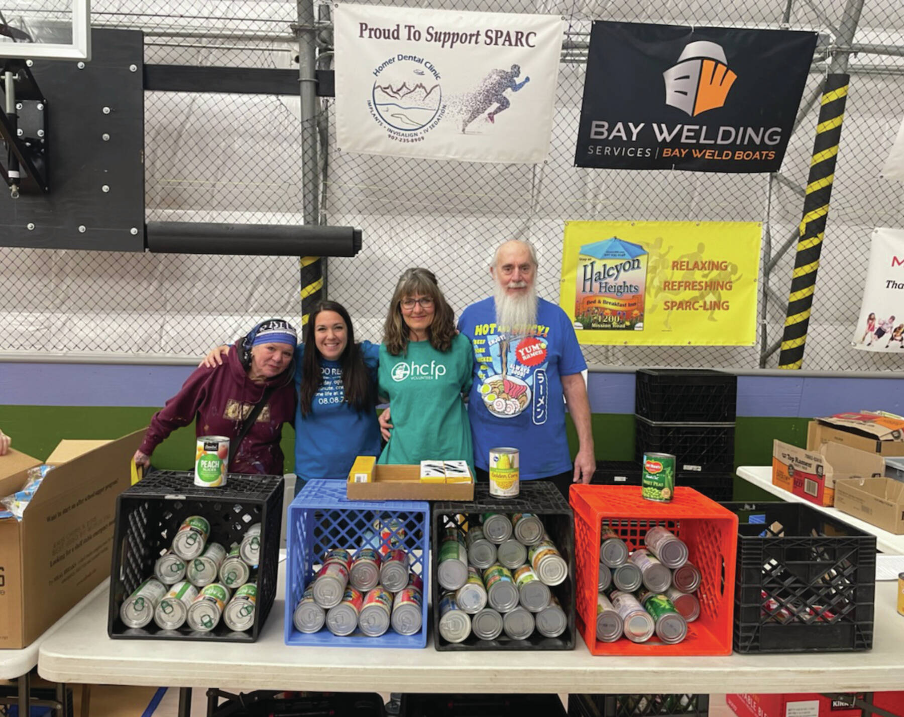 Emilie Springer/Homer News
From left: RJ Nelson, Jaclyn Rainwater, Debbie Vantrease, Wendall Cummings stand at the Homer Community Food Pantry booth at the Community Resource Connect event on Jan. 30 at the SPARC in Homer.
