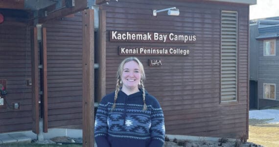 Sara Wilhelm, a 2020 Semester by the Bay alumni and current lab technician stands outside of Pioneer Hall at Kachemak Bay Campus on Jan. 25. (Emilie Springer/Homer News)