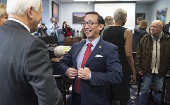 Sen. Scott Kawasaki, D-Fairbanks, gathers with other senators and families as they prepare for the opening of the Alaska’s 31st Legislative Session on Tuesday, Jan. 15, 2019. (Michael Penn | Juneau Empire)