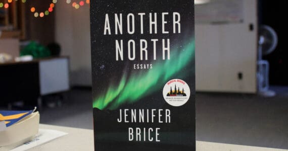 A copy of Jennifer Brice’s “Another North: Essays” rests on a desk inside the Peninsula Clarion offices on Thursday, Feb. 8, 2024 in Kenai, AK. (Ashlyn O’Hara/Peninsula Clarion)