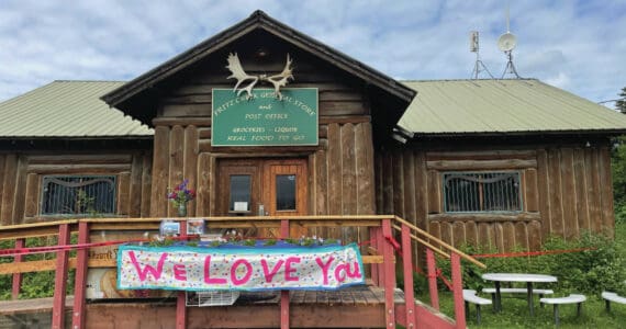 A sign reading “We love you” expresses community support for the Fritz Creek General Store on Saturday, July 8, 2023, after a fire severely damaged it on July 6. (Emilie Springer/Homer News)