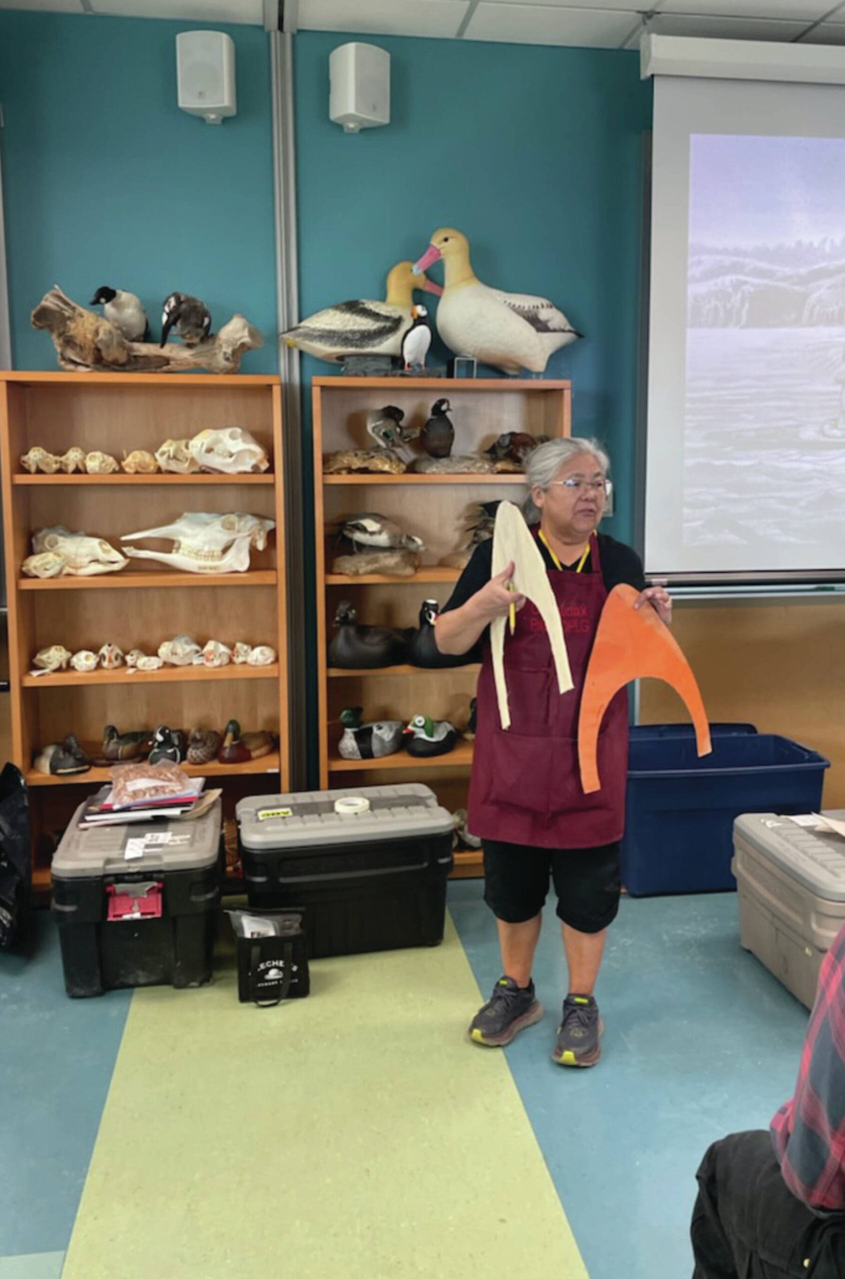 Photo by Emilie Springer
Patty Lekanoff-Gregory displays two hat forms to students attending the bentwood hat making course at the Alaska Maritime National Wildlife Refuge Visitor Center on Sunday.