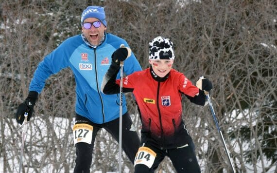 NIva Flagstad, 11, leads her father, Trond Flagstad, associate head coach for men's and women's Nordic skiing at the University of Alaska Anchorage, up a long climb in the Kachemak Ski Marathon just outside of Homer, Alaska, on Saturday, March 16, 2024. (Photo by Erin Thompson/Peninsula Clarion)