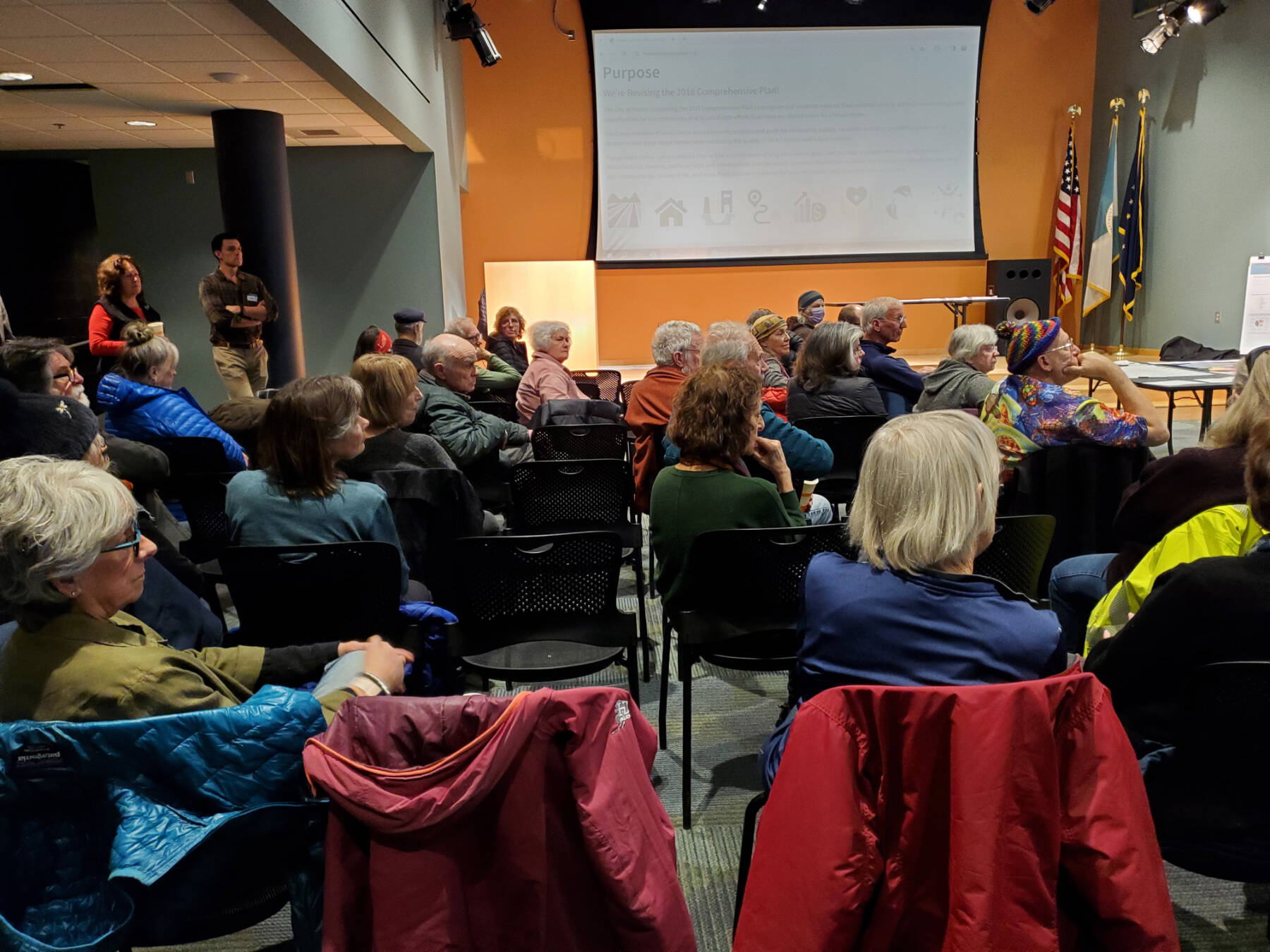 Attendees of the Comprehensive Plan Open House listen to an introduction from Agnew::Beck project consultants on Thursday, March 28, 2024 at the Alaska Maritime National Wildlife Refuge Visitor Center auditorium in Homer, Alaska. (Delcenia Cosman/Homer News)
