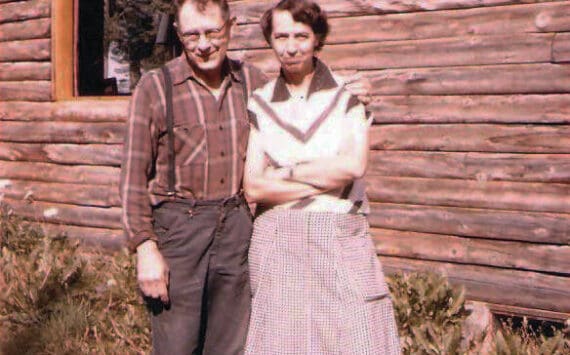 Photo courtesy of Katie Matthews
This is the only known photograph of Rex Hanks, seen here with his wife, Irmgard, next to their two-story home in Happy Valley—circa 1950s.