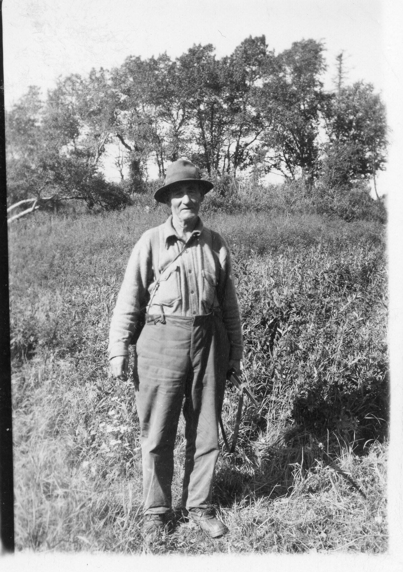 Photo courtesy of Katie Matthews
One of Rex Hanks’s early “neighbors” was Frank M. Larson, seen here with his rifle in the late 1940s, shortly after he moved to the Happy Valley area.