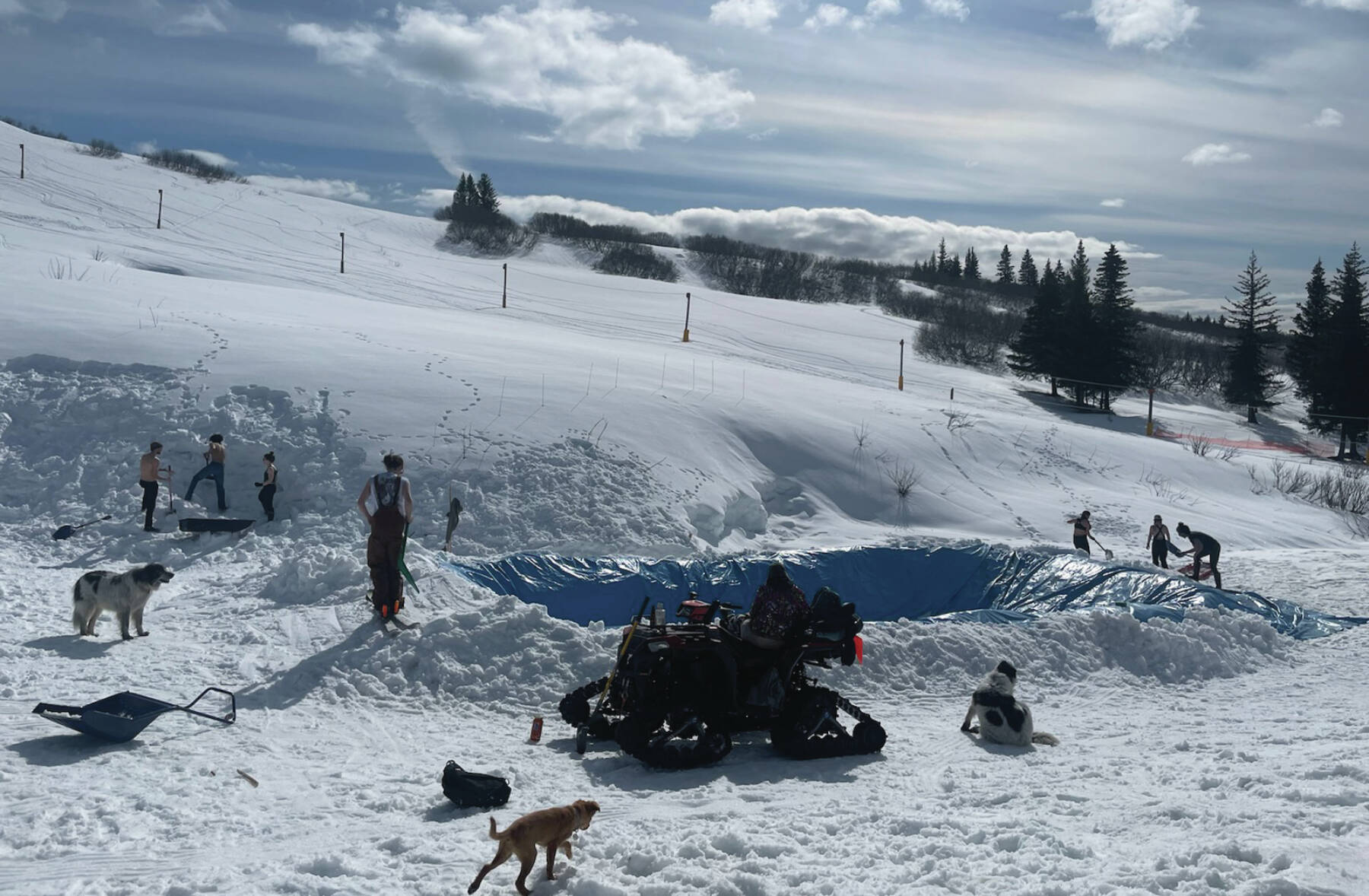 Photo provided by Sarah Banks
Volunteers help dig out the slush pit for the 2024 RopeTowPalooza at the base of the Ohlson Mountain ski hill last Thursday.