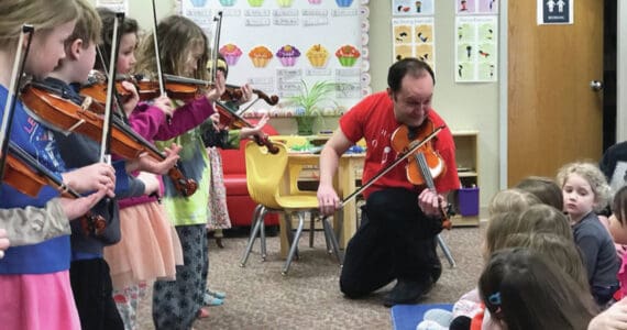 Photo provided by Kim Fine
Fireweed Frescoes share their violin music with pre-school students at the Girassol Learning Center and help them to make cardboard violins on April 5 as part of the Festival of Strings April celebration.