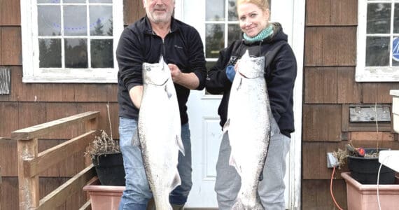 The 28th annual Anchor Point King Salmon Tournament first and second place winners, Judy Persnail (right) and Mark Tornai (left) from the boat Outlaw hold up their fish during weigh-in on Saturday, May 6, 2023 at the Anchor Point Chamber of Commerce building in Anchor Point, Alaska. Photo courtesy of Mcki Needham