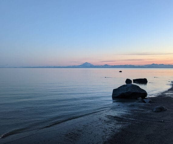 Mount Redoubt can be seen acoss Cook Inlet from North Kenai Beach on Thursday, July 2, 2022. (Photo by Erin Thompson/Peninsula Clarion)