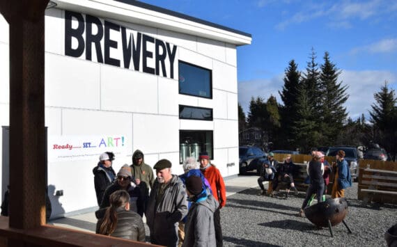 Homer community members chat with artists during the Ready, Set, Art! fundraiser at Grace Ridge Brewing on Saturday, April 13, 2024 in Homer, Alaska. (Delcenia Cosman/Homer News)