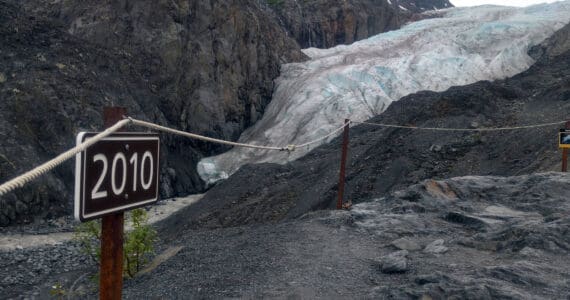 A sign along a trail to Exit Glacier marks the spot to where the toe of the glacier reached in 2010, photographed on June 22, 2018. (Photo by Erin Thompson/Peninsula Clarion)