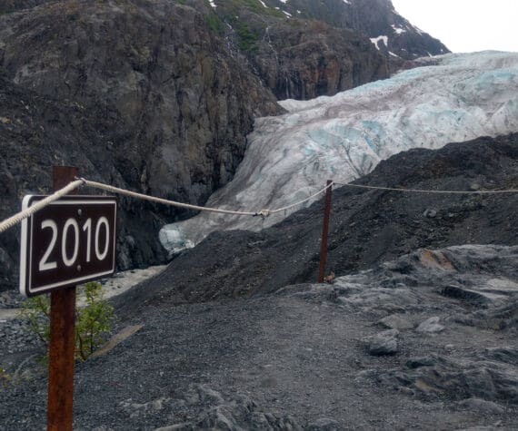 A sign along a trail to Exit Glacier marks the spot to where the toe of the glacier reached in 2010, photographed on June 22, 2018. (Photo by Erin Thompson/Peninsula Clarion)