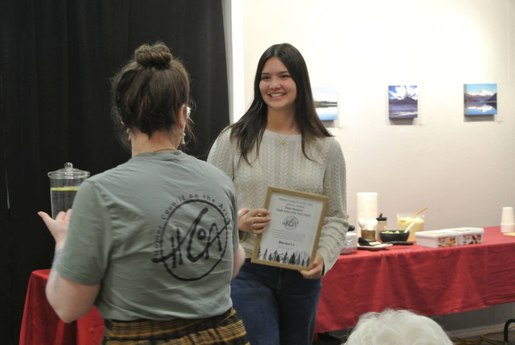 Homer High School student Marina Co is presented with the Diane Borgman Youth Artist of Year Award at Homer Council on the Arts’ annual Community Arts Award Ceremony on Saturday, July 19, 2025, in Homer, Alaska. (Delcenia Cosman/Homer News)