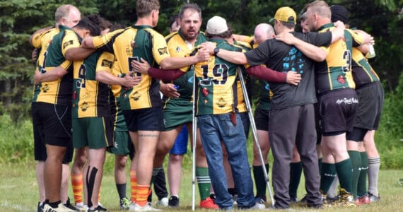 Danny Autrey fires up his Kenai River Wolfpack teammates before a match at the Kenai Dipnet Fest Rugby 10s Tournament at Kenai’s Millennium Square on Saturday, July 19, 2025. (Photo by Jeff Helminiak/Peninsula Clarion)