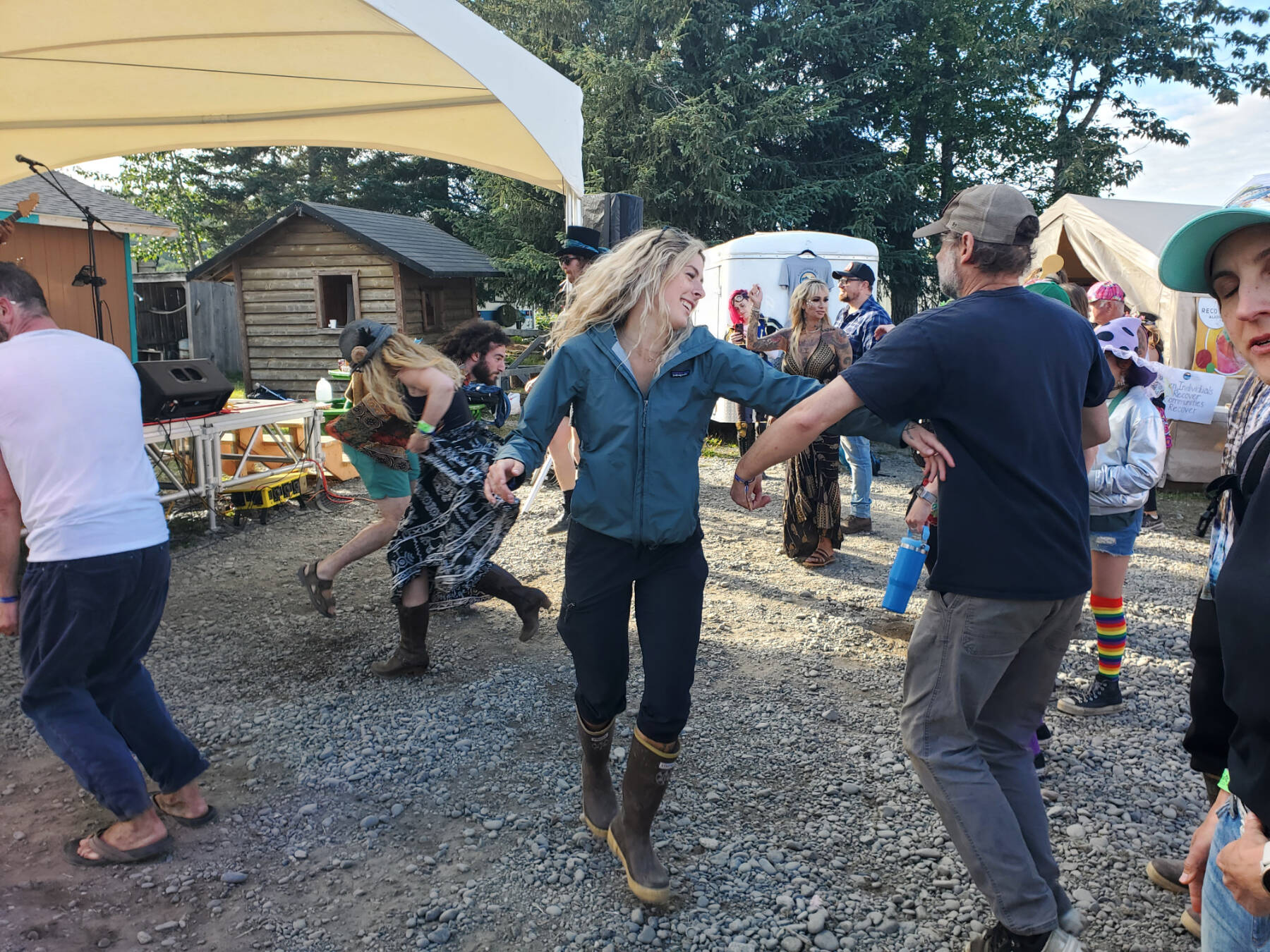 Concert-goers dance to music by Cousin Curtiss and Harrison B during Salmonfest on Sunday, Aug. 3, 2025, at the Headwaters Stage in the Kenai Peninsula Fairgrounds in Ninilchik, Alaska. (Delcenia Cosman/Homer News)
