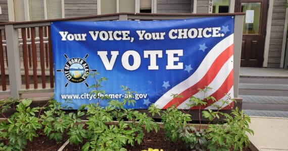 A banner encouraging Homer residents to vote is displayed outside City Hall on Thursday, Sept. 12, 2024 in Homer, Alaska. (Delcenia Cosman/Homer News)