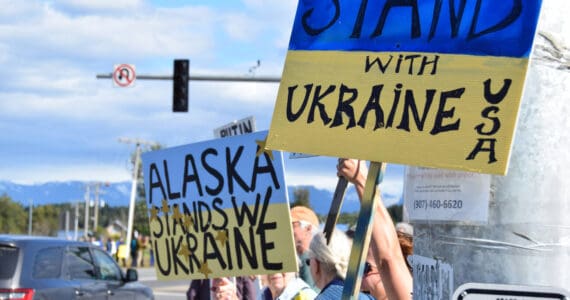 Protestors hold up signs expressing support for Ukraine on Friday, Aug. 15, 2025, in Homer, Alaska. (Delcenia Cosman)