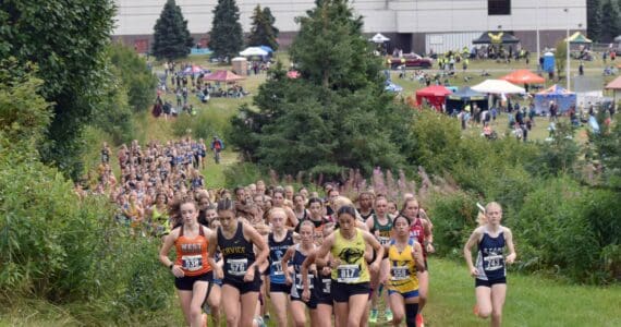 Service's Talia Smith leads the girls varsity pack near the start of the Ted McKenney XC Invitational on Saturday, Aug. 23, 2025, at Tsalteshi Trails just outside of Soldotna, Alaska. (Photo by Jeff Helminiak/Peninsula Clarion)