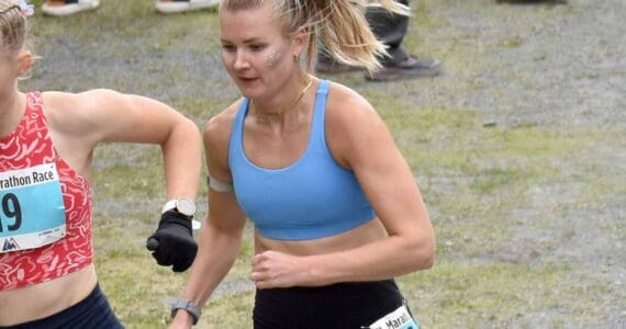 Nevada's Claire Nelson, 22, and Anchorage's Taylor Deal, 31, approach the mountain during the women's race at the Mount Marathon Race on July 4, 2025, in Seward, Alaska. (Photo by Jeff Helminiak/Peninsula Clarion)