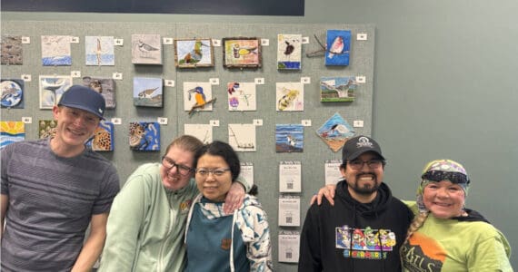 Artists in the Homer Independent Living Center's Artability program are photographed with their artwork on display at the Alaska Maritime National Wildlife Refuge during the 2025 Shorebird Festival in Homer, Alaska. Photo provided by the Independent Living Center