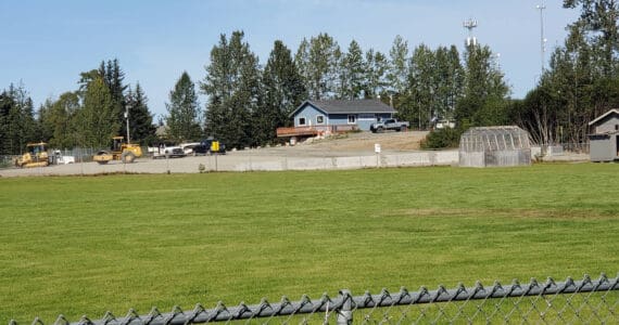 Heavy equipment operators finalize phase one construction of a new student pick-up/drop-off zone behind Chapman School on Friday, Aug. 22, 2025, in Anchor Point, Alaska. (Photo by Delcenia Cosman/Homer News)