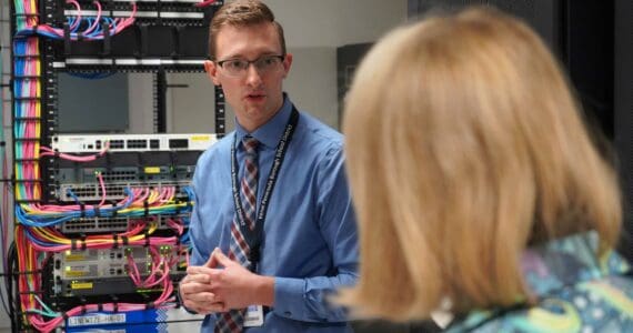 Kenai Peninsula Borough School District IT Manager Jordan Chilson leads a tour of the district’s server infrastructure in Soldotna, Alaska, on Wednesday, Aug. 20, 2025. (Jake Dye/Peninsula Clarion)