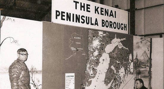 In this old Cheechako News photo, officials consider an early display map of the Kenai Peninsula Borough, 1969.