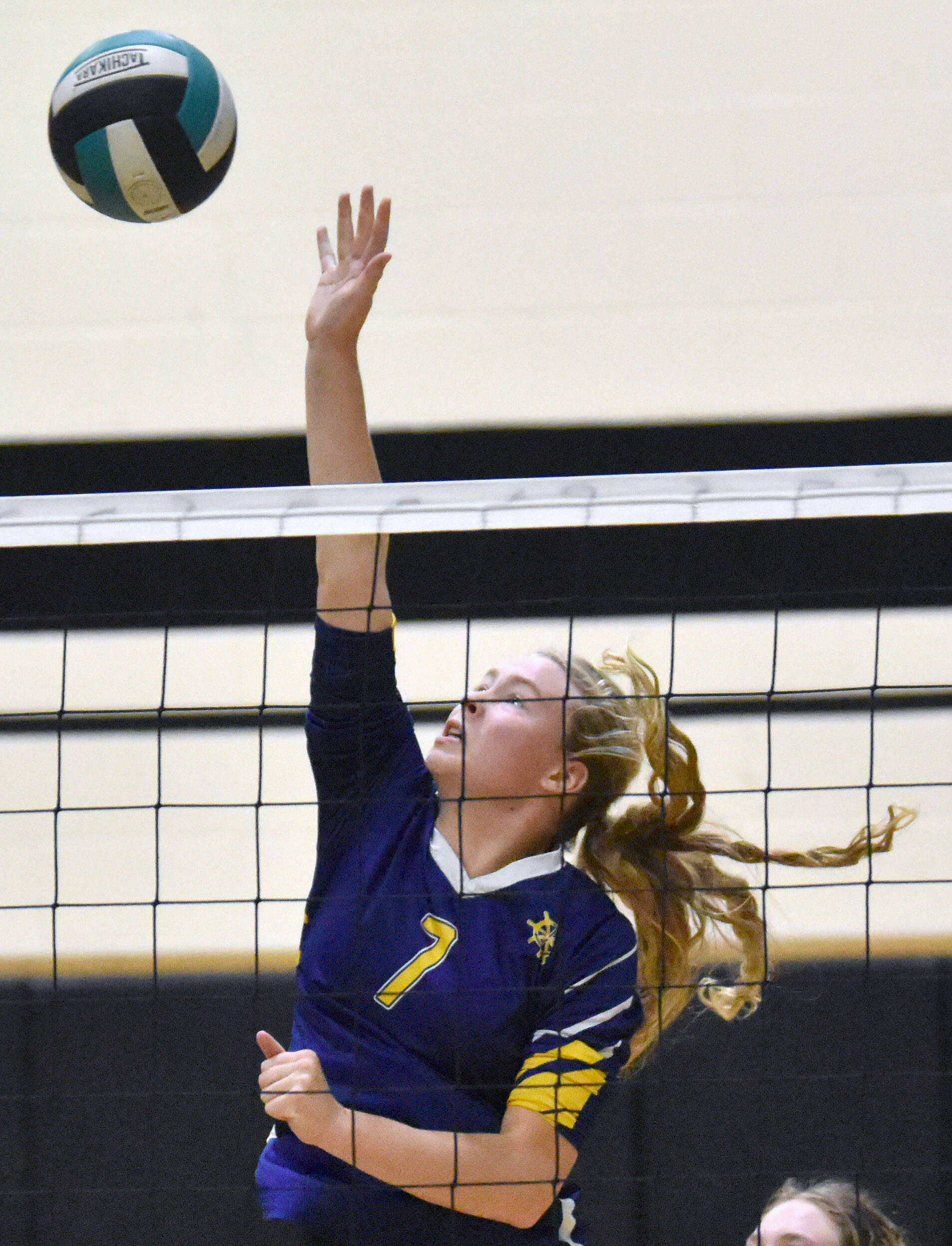 Homers Swift Blackstock attacks against Nikiski on Saturday, Sept. 6, 2025, at the 18th annual Shayna Pritchard Memorial Volleyball Tournament at Nikiski Middle-High School in Nikiski, Alaska. (Photo by Jeff Helminiak/Peninsula Clarion)