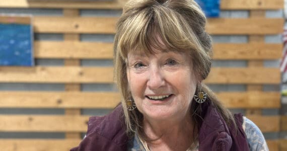 Artist Rosemary "Rozzi" Redmond shows a series of acrylic paintings with fishing themes at Grace Ridge Brewing in Homer, Alaska. The exhibit is open through September 2025. Photo by Christina Whiting