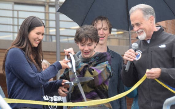 Homer High School Student Body President Marina Co and Vice President Reid Rauch cut the ribbon on Thursday, Sept. 11, 2025 while KPB Mayor Peter Micciche and Homer High School Principal Eric Pederson look on. (Chloe Pleznac/Homer News)