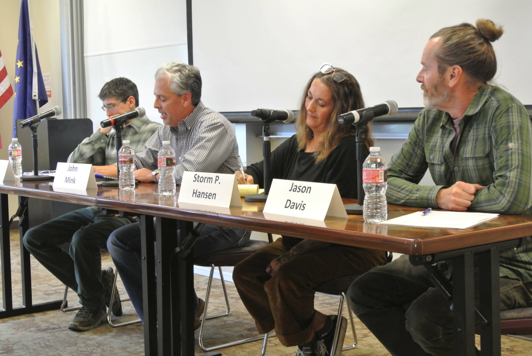(from left to right) Elias Garvey, John Mink, Storm Hansen and Jason Davis answer questions during the Homer City Council candidate forum hosted by the Homer Chamber of Commerce on Tuesday, Sept. 16, 2025, at Kachemak Bay Campus in Homer, Alaska. (Delcenia Cosman/Homer News)