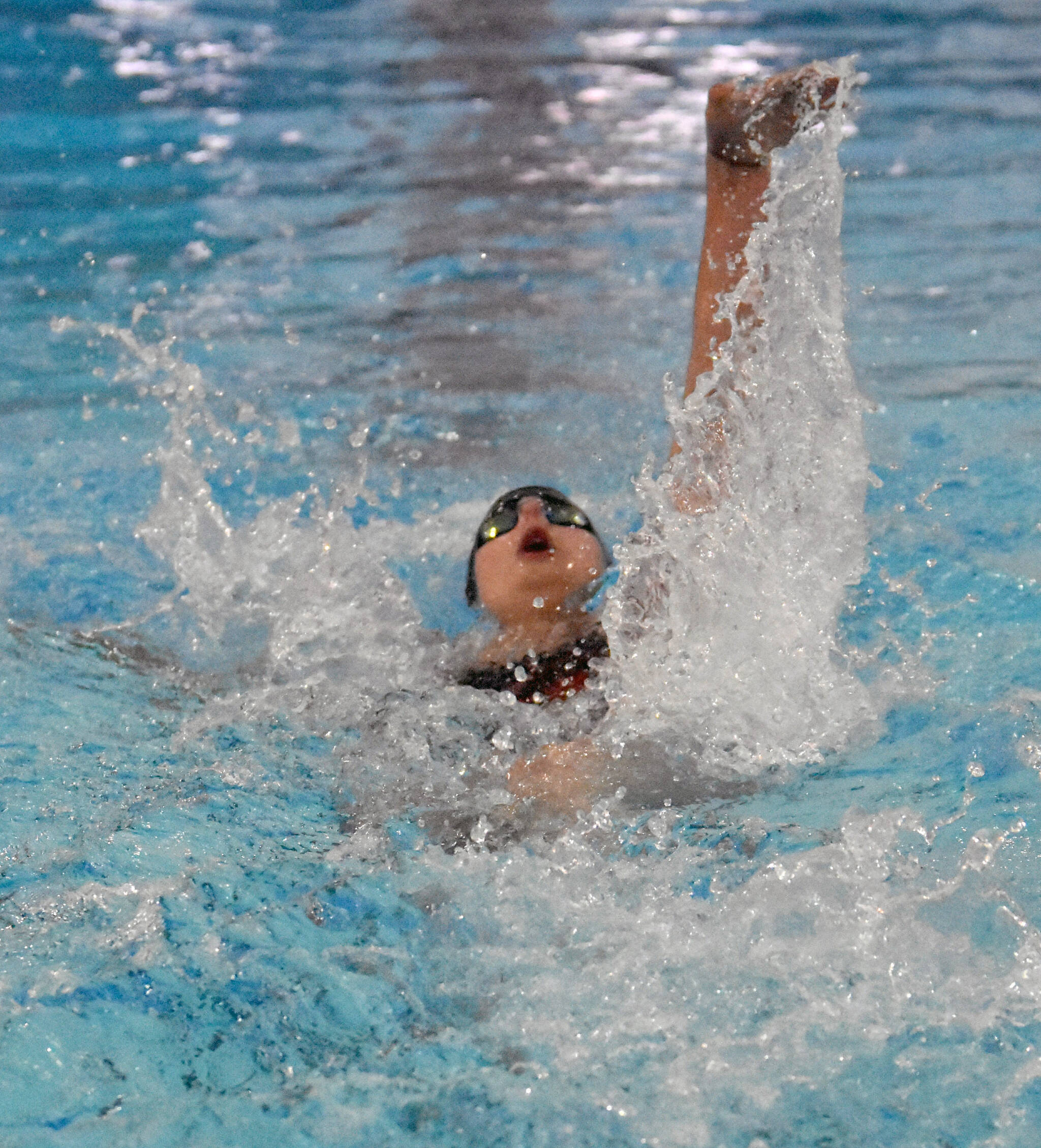 Kenai Centrals Abigail Price competes in the 100-yard backstroke at the Kenai Invitational at Kenai Central High School on Saturday, Sept. 20, 2025, in Kenai, Alaska. (Photo by Jeff Helminiak/Peninsula Clarion)