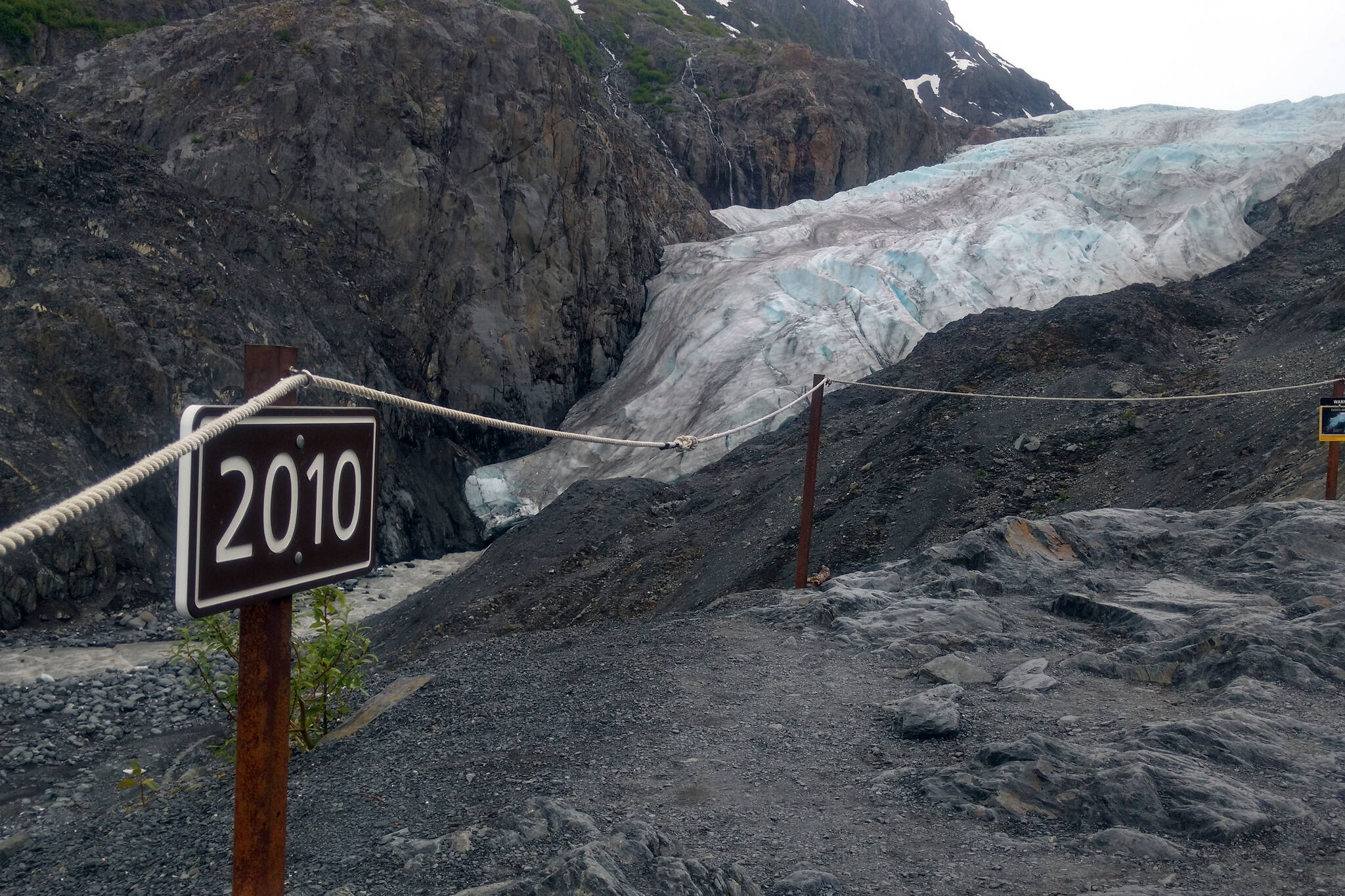 Photo by Erin Thompson/Peninsula Clarion 
A sign along a trail to Exit Glacier marks the spot to where the toe of the glacier reached in 2010, photographed on June 22, 2018.
