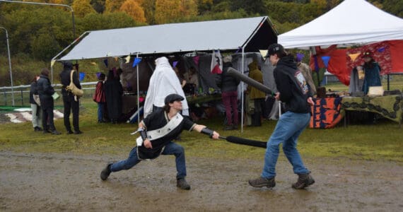 Delcenia Cosman/Homer News
Two fairgoers battle it out with foam swords opposite the sparring arena at Ye Olde Harvest Festival at Karen Hornaday Park on Saturday, Oct. 5, 2024<ins>,</ins><ins> in Homer, </ins><ins>Alaska</ins>.
Two fairgoers battle it out with foam swords opposite the sparring arena at Ye Olde Harvest Festival at Karen Hornaday Park on Saturday, Oct. 5, 2024<ins>,</ins><ins> in Homer, </ins><ins>Alaska</ins>. (Delcenia Cosman/Homer News)