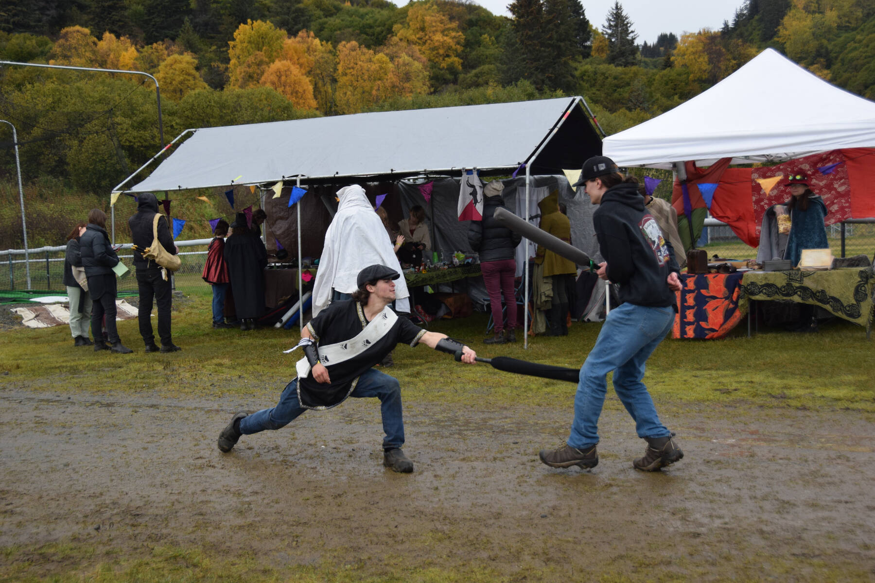Delcenia Cosman/Homer News
Two fairgoers battle it out with foam swords opposite the sparring arena at Ye Olde Harvest Festival at Karen Hornaday Park on Saturday, Oct. 5, 2024<ins>,</ins><ins> in Homer, </ins><ins>Alaska</ins>.
Two fairgoers battle it out with foam swords opposite the sparring arena at Ye Olde Harvest Festival at Karen Hornaday Park on Saturday, Oct. 5, 2024<ins>,</ins><ins> in Homer, </ins><ins>Alaska</ins>. (Delcenia Cosman/Homer News)