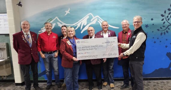 Homer Elks Lodge #2127 Exalted Ruler Jill Hockema (center) and members of the Homer Elks Lodge donate $3,500, using grant funds received, to West Homer Elementary School in Homer, Alaska, on Sept. 22, 2025, to provide fourth-grade students the opportunity to participate in the annual Outdoor Education Field Trip scheduled for May 2026. Photo provided by Jill Hockema