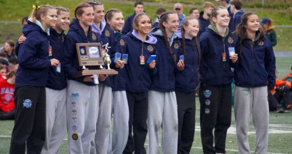 The Homer Mariner girls stand with their trophy after claiming the title at the 2025 ASAA Cross Country Division II Championships at Mike Janecek Trails in Palmer, Alaska, on Saturday, Oct. 4, 2025. Photo courtesy Jake Dye