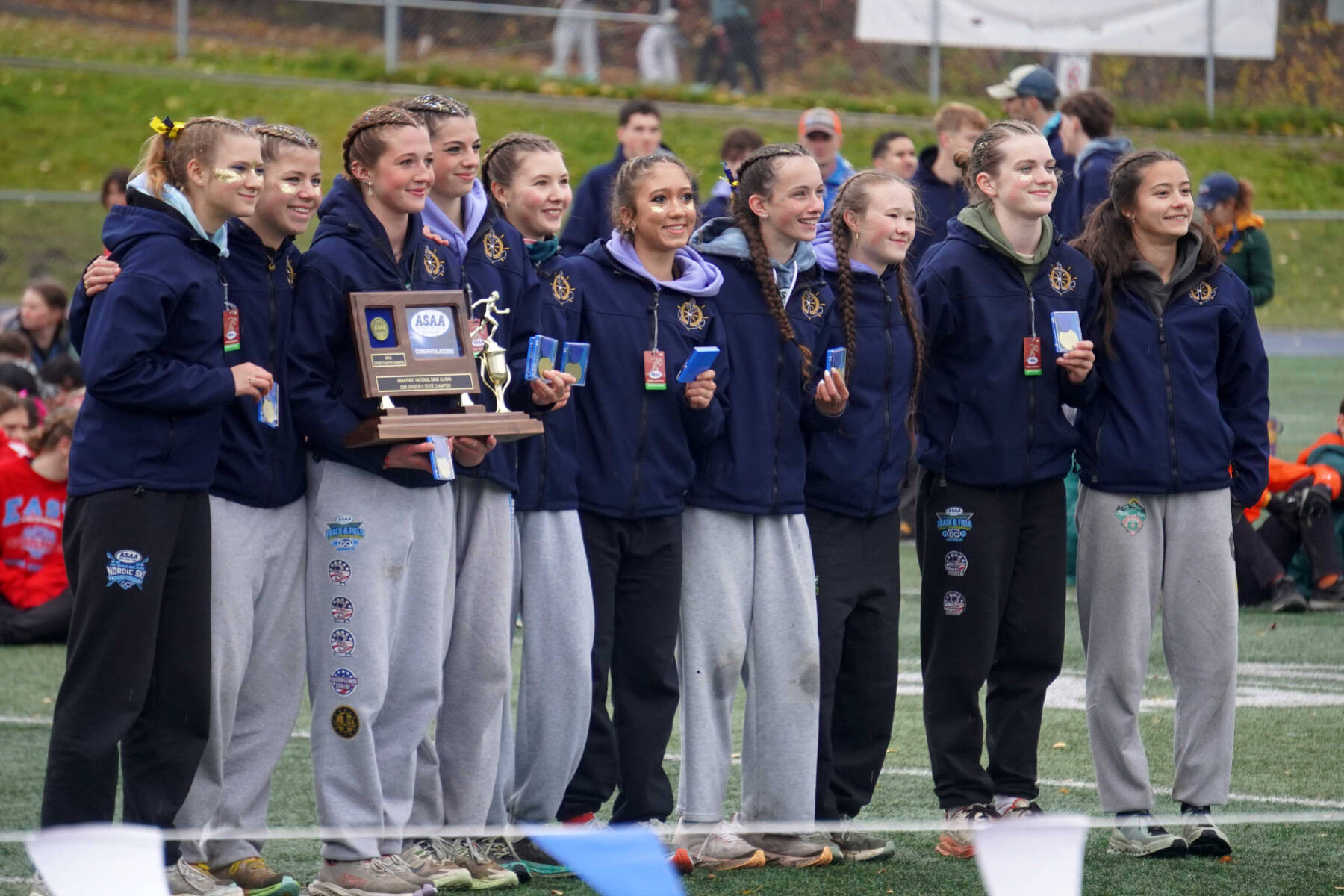 The Homer Mariner girls stand with their trophy after claiming the title at the 2025 ASAA Cross Country Division II Championships at Mike Janecek Trails in Palmer, Alaska, on Saturday, Oct. 4, 2025. Photo courtesy Jake Dye