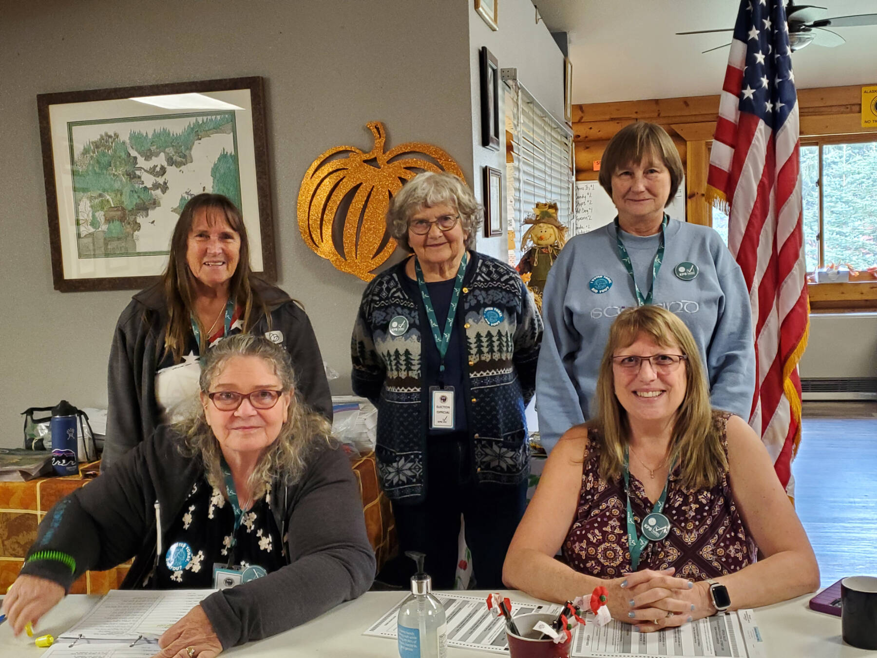 (from left to right, rear to front) Election workers Bobbi Ness, Carol Slavik, Mary Perry, Eva Stovall and Maureen Tracy help voters cast their ballots on Election Day, Tuesday, Oct. 7, 2025, at the Anchor Point Community and Senior Center in Anchor Point, Alaska. (Delcenia Cosman/Homer News)